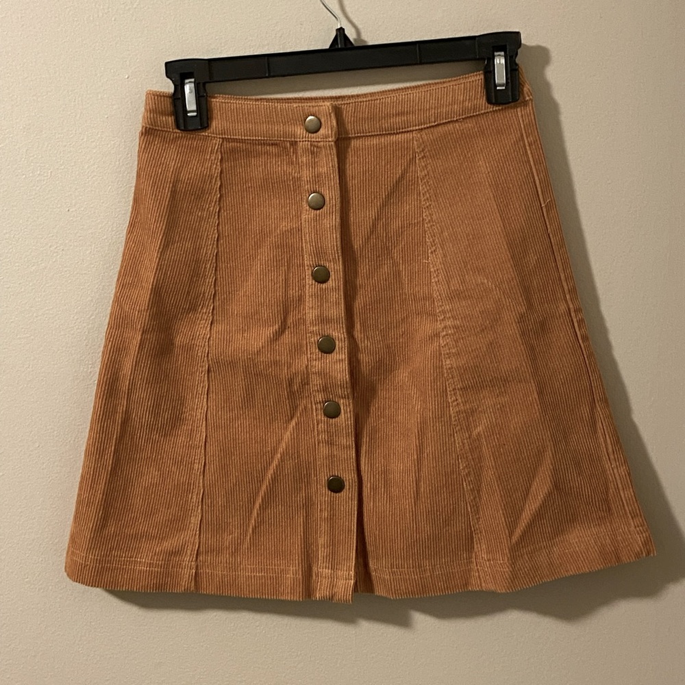 Never worn, button up soprano skirt!